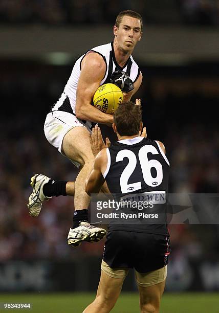 Nick Maxwell of the Magpies marks over Nick Dal Santo of the Saints during the round three AFL match between the St Kilda Saints and the Collingwood...