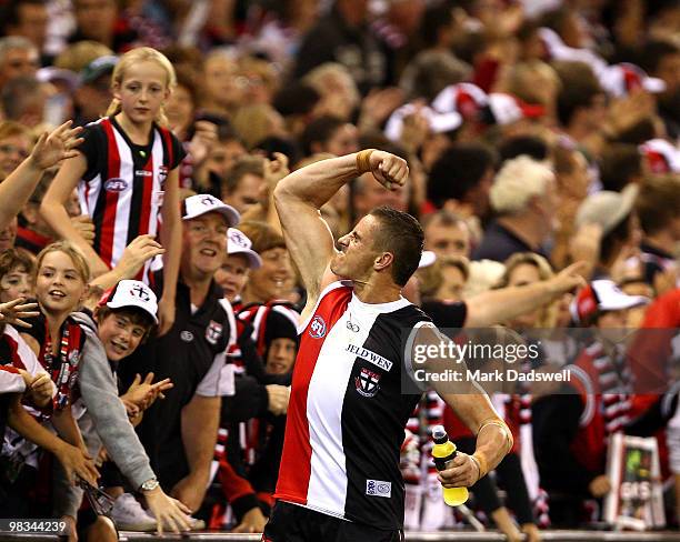 Michael Gardiner of the Saints celebrates with fans after his teams win in the round three AFL match between the St Kilda Saints and the Collingwood...