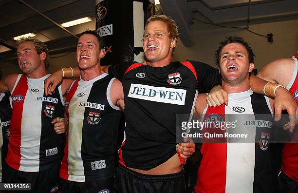 Jason Gram, Jason Blake, Nick Riewoldt and Adam Schneider of the Saints sing the songs in the room after winning the round three AFL match between...