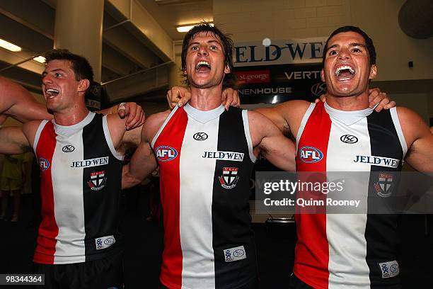 Andrew McQualter, Farren Ray and Leigh Montagna of the Saints sing the songs in the room after winning the round three AFL match between the St Kilda...