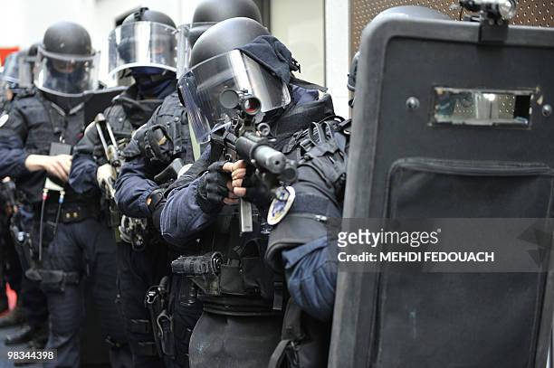 French National Gendarmerie Intervention Group members present the equipment on April 8, 2010 in Satory, west of Paris, during the inauguration of a...