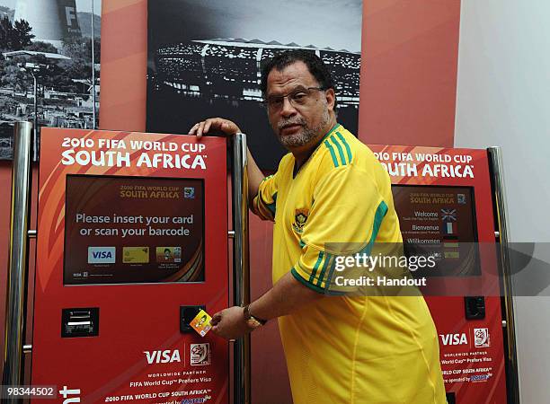 In this handout image provided by the 2010 FIFA World Cup Organising Committee South Africa, Danny Jordaan demonstrates the official ticket during...