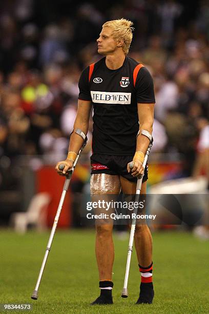 Nick Riewoldt of the Saints walks off the ground on crutches during the round three AFL match between the St Kilda Saints and the Collingwood Magpies...