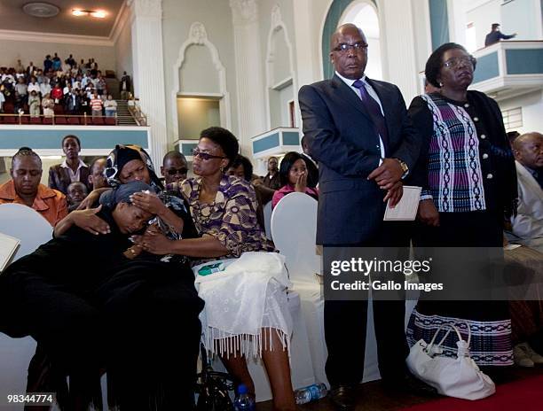 Kgomotso Sefularo comforts her daughter, Ipeleng during the memorial service for South African Deputy Minister Of Health Molefi Sefularo on April 8,...