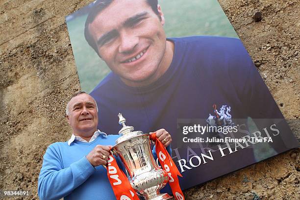 Ex Chelsea Football player Ron Harris poses with the FA Cup as the trophy takes a tour at Stamford Bridge on April 9, 2010 in London, England.