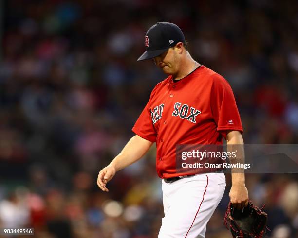 Steven Wright of the Boston Red Sox leaves the mound in the bottom of the fourth inning of the game against the Seattle Mariners at Fenway Park on...