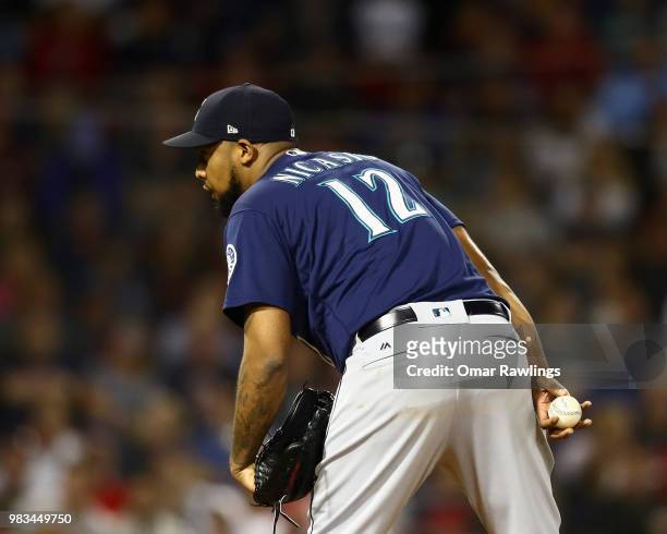 Juan Nicasio of the Seattle Mariners looks on before pitching in the bottom of the seventh inning of the game against the Boston Red Sox at Fenway...