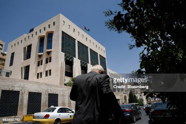 Pedestrian passes the headquarters of Jordan's central bank in Amman, Jordan, on Thursday, June 21, 2018. President Trump and First Lady Melania...