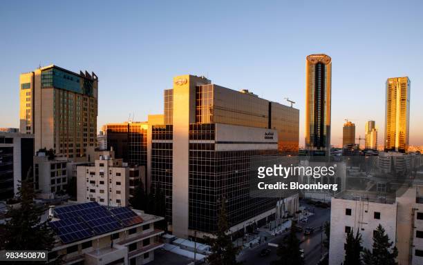 The headquarters of Arab Bank Plc, center, and Al Abdali district sits on the city skyline during sunset in Amman, Jordan, on Thursday, June 21,...