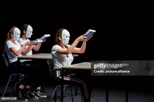 June 2018, Germany, Berlin: Students from the Manfred von Ardenne High School Berlin wearing masks and dancing before classmates during the award of...