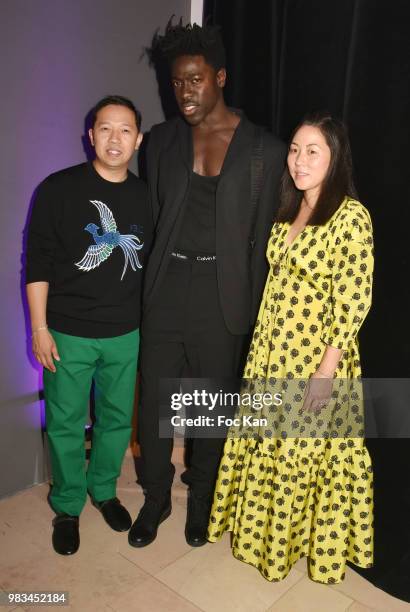 Designer Humberto Leon, Moses Sumney and designer Carol Lim attend the Kenzo Menswear /womenswear Spring/Summer 2019 show as part of Paris Fashion...