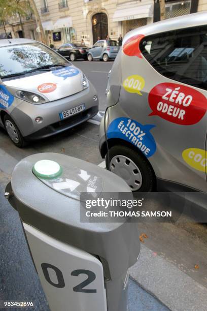 Bluecar next to the renting machine system is pictured on October 2, 2011 in Paris, at the first day of a test session of the Autolib electric car...