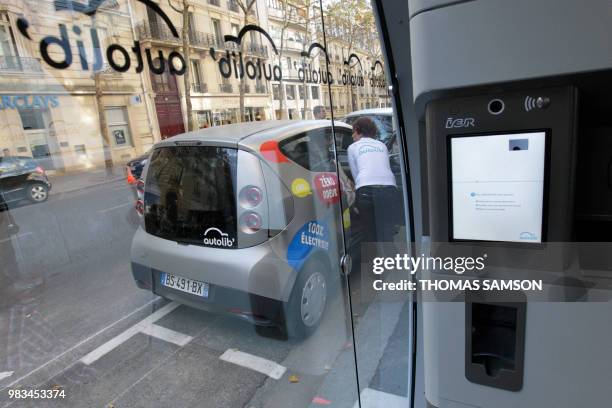 An Autolib official tests the Bluecar on October 2, 2011 in Paris, at the first day of a test session of the Autolib electric car pick-up service....