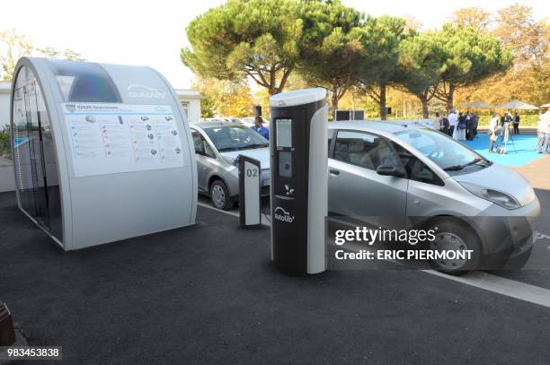 Bluecars are pictured near a station at the Autolib operational Center in Vaucresson, near Paris, on September 30, 2011 during a presentation of the...