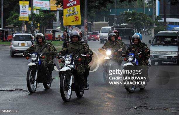 Sri Lankan amy commandos patrol on motorcycles in Colombo on April 9, 2010. Sri Lanka's ruling party cruised to victory Friday in parliamentary...