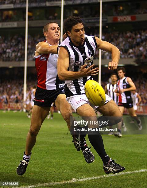 Steven Baker of the Saints competes with Paul Medhurst of the Magpies during the round three AFL match between the St Kilda Saints and the...