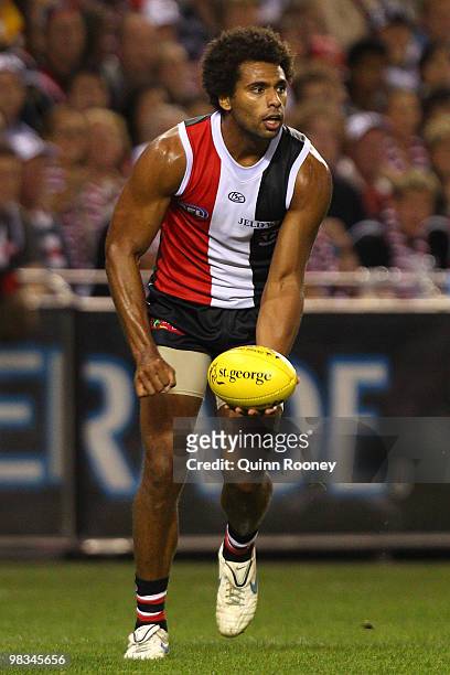 James Gwilt of the Saints handballs during the round three AFL match between the St Kilda Saints and the Collingwood Magpies at Etihad Stadium on...