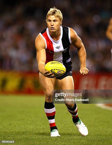 Clinton Jones of the Saints hanballs during the round three AFL match between the St Kilda Saints and the Collingwood Magpies at Etihad Stadium on...