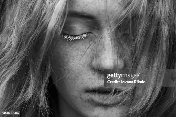 a young woman with freckles. - jovanat stock pictures, royalty-free photos & images