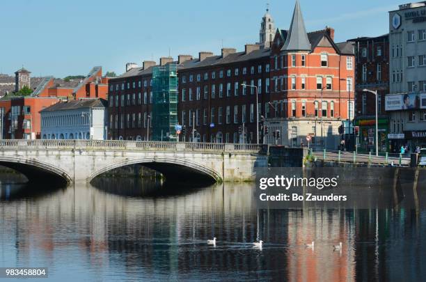 st patrick's bridge across river lee, in cork, ireland. - river lee cork stock pictures, royalty-free photos & images