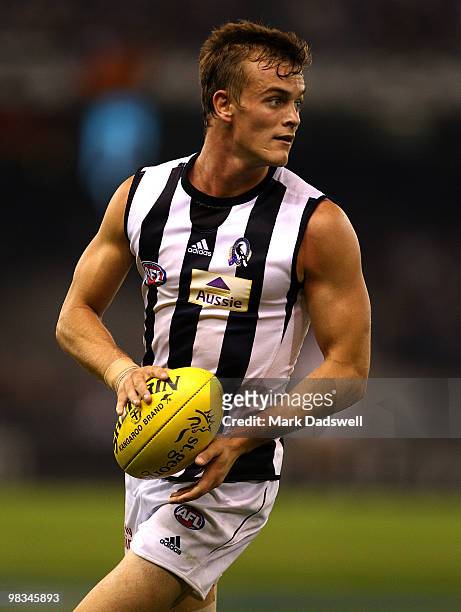 John McCarthy of the Magpies looks for a teammate during the round three AFL match between the St Kilda Saints and the Collingwood Magpies at Etihad...