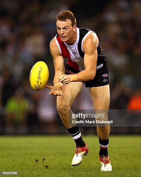Brendon Goddard of the Saints hanballs during the round three AFL match between the St Kilda Saints and the Collingwood Magpies at Etihad Stadium on...