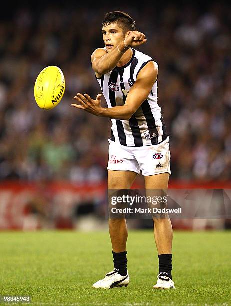 Sharrod Wellingham of the Magpies handballs during the round three AFL match between the St Kilda Saints and the Collingwood Magpies at Etihad...