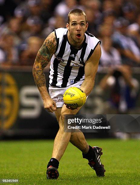 Dane Swan of the Magpies handballs during the round three AFL match between the St Kilda Saints and the Collingwood Magpies at Etihad Stadium on...