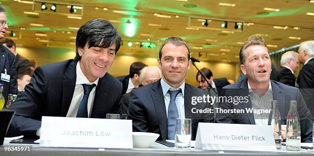 Head coach of German National Football team Joachim Loew, second coach Hans Dieter Flick and Andreas Koepke smile during the German Football...