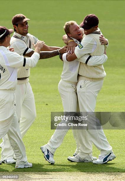 Gareth Batty and Andre Nel of Surrey celebrate the wicket of Garry Park of Derbyshire during the LV County Championship, Division two match between...
