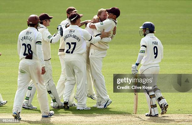 Gareth Batty and Andre Nel of Surrey celebrate the wicket of Garry Park of Derbyshire during the LV County Championship, Division two match between...