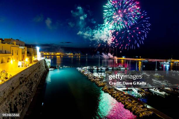 colourful fireworks display in a marina - otranto foto e immagini stock