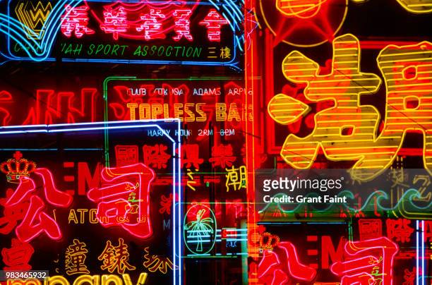a composite image with many view of neon signs at night - hongkong stock pictures, royalty-free photos & images