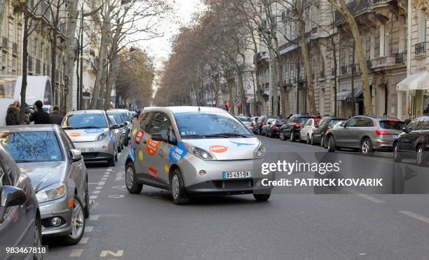 Picture taken on December 2, 2011 in Paris shows an Autolib electric bluecar in a street of Paris, on the day of the official presentation of this...