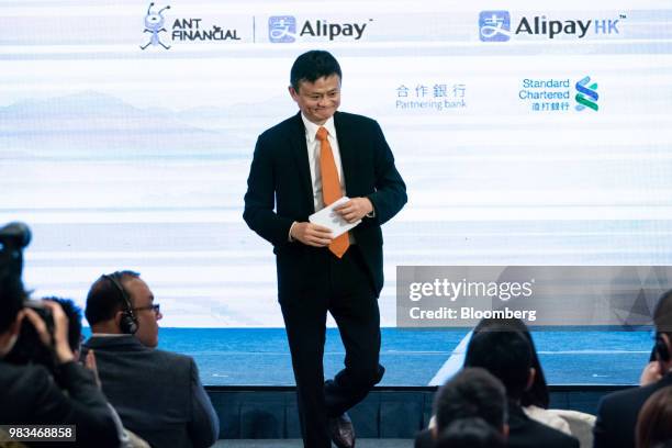 Jack Ma, chairman of Alibaba Group Holding Ltd., leaves the stage after speaking at a news conference in Hong Kong, China, on Monday, June 25, 2018....