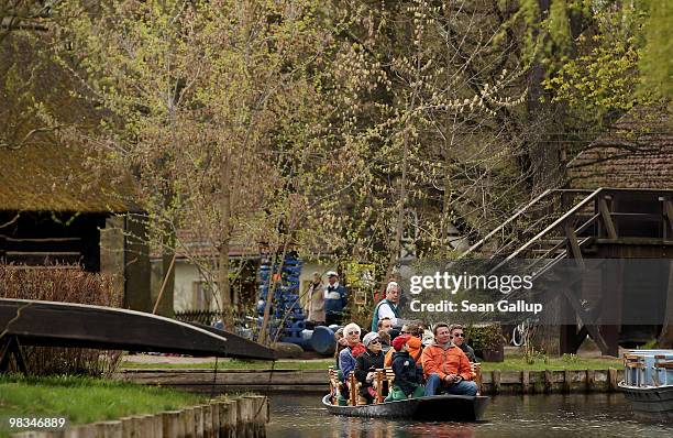 Man ferrying tourists in a pirogue navigates the narrow canals of the Spreewald forest on April 9, 2010 in Luebbenau, Germany. The Spreewald is...