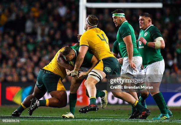 Sydney , Australia - 23 June 2018; Jordan Larmour of Ireland is tackled by Lukhan Tui and Izack Rodda of Australia during the 2018 Mitsubishi Estate...