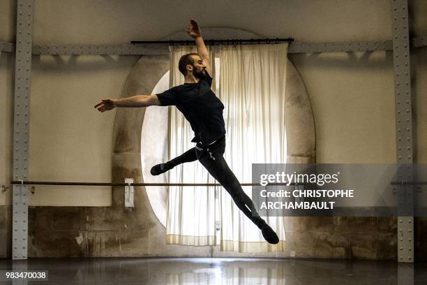 Premier Danseur of the Paris Ballet Opera, Francois Alu, rehearses during a photo session at the Opera Garnier in Paris on June 21, 2018.