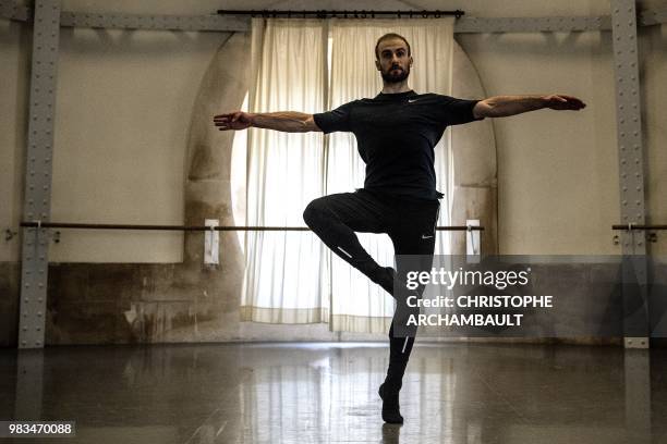 Premier Danseur of the Paris Ballet Opera, Francois Alu, rehearses during a photo session at the Opera Garnier in Paris on June 21, 2018.