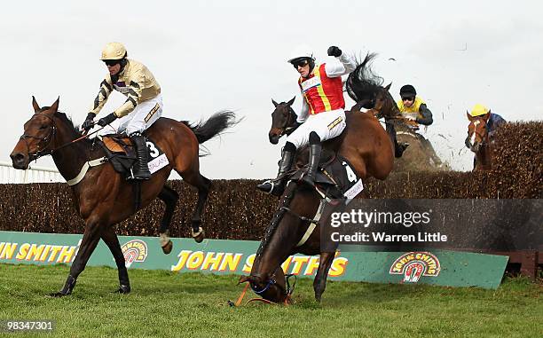 Jason Maguire takes a fall ridding Khachaturian in The matalan.co.uk Mildmay Novices' Steeple Chase at Aintree racecourse on April 9, 2010 in...