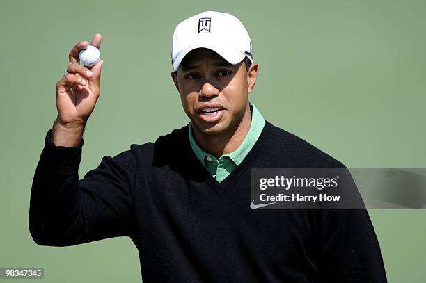 Tiger Woods waves his golf ball in the air after playing the second hole during the second round of the 2010 Masters Tournament at Augusta National...