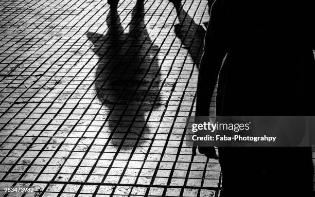 a person being stalked - stalking stock pictures, royalty-free photos & images