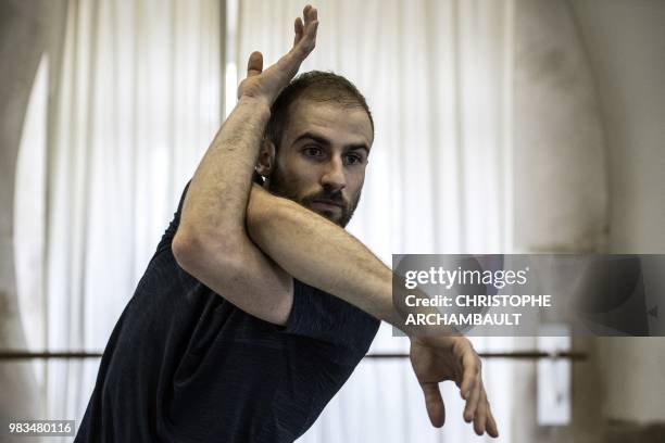 Premier Danseur of the Paris Ballet Opera, Francois Alu, rehearses during a photo session at the Opera Garnier in Paris on June 21, 2018.