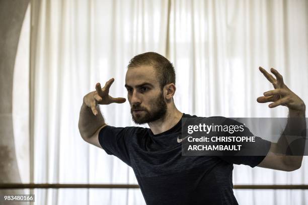 Premier Danseur of the Paris Ballet Opera, Francois Alu, rehearses during a photo session at the Opera Garnier in Paris on June 21, 2018.