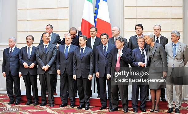 French President Nicolas Sarkozy and Italian Prime Minister Silvio Berlusconi pose for photographers with their ministers after a working lunch at...