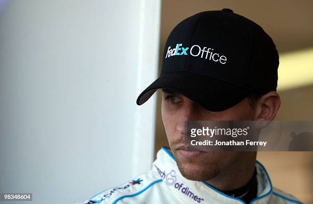 Denny Hamlin, driver of the FedEx Office/March of DimesToyota, looks on during practice for the NASCAR Sprint Cup Series Subway Fresh Fit 600 at...