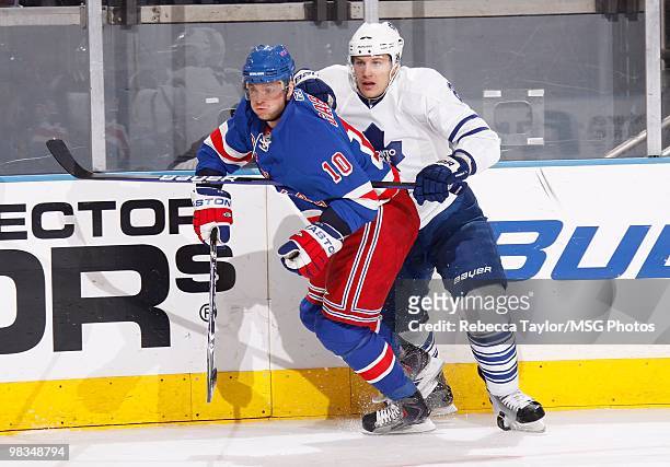 Marian Gaborik of the New York Rangers skates against Luke Schenn of the Toronto Maple Leafs on April 7, 2010 at Madison Square Garden in New York...