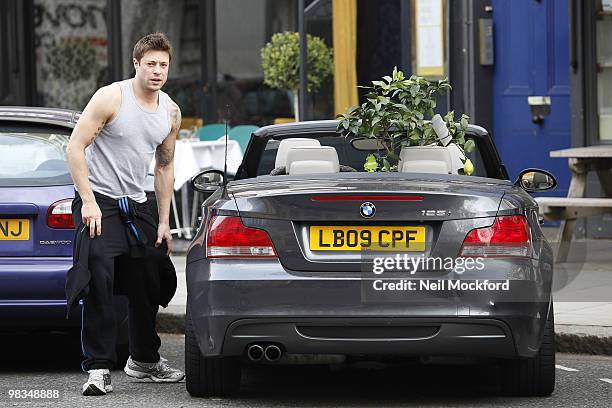 Duncan James loads a Lemon tree into his car, which was a birthday present from his mum, in Primrose Hill on April 9, 2010 in London, England.