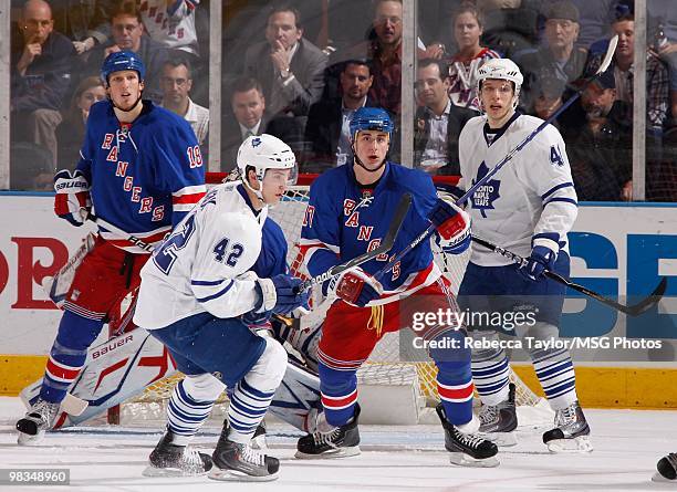 Brandon Dubinsky and Marc Staal of the New York Rangers defend against Nikolai Kulemin and Tyler Bozak of the Toronto Maple Leafs on April 7, 2010 at...