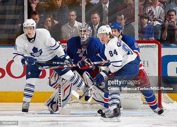 Dan Girardi and Henrik Lundqvist of the New York Rangers defend against Nikolai Kulemin and Mikhail Grabovski of the Toronto Maple Leafs on April 7,...